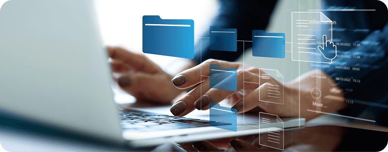 Hands typing on laptop with data analytics graphics overlay