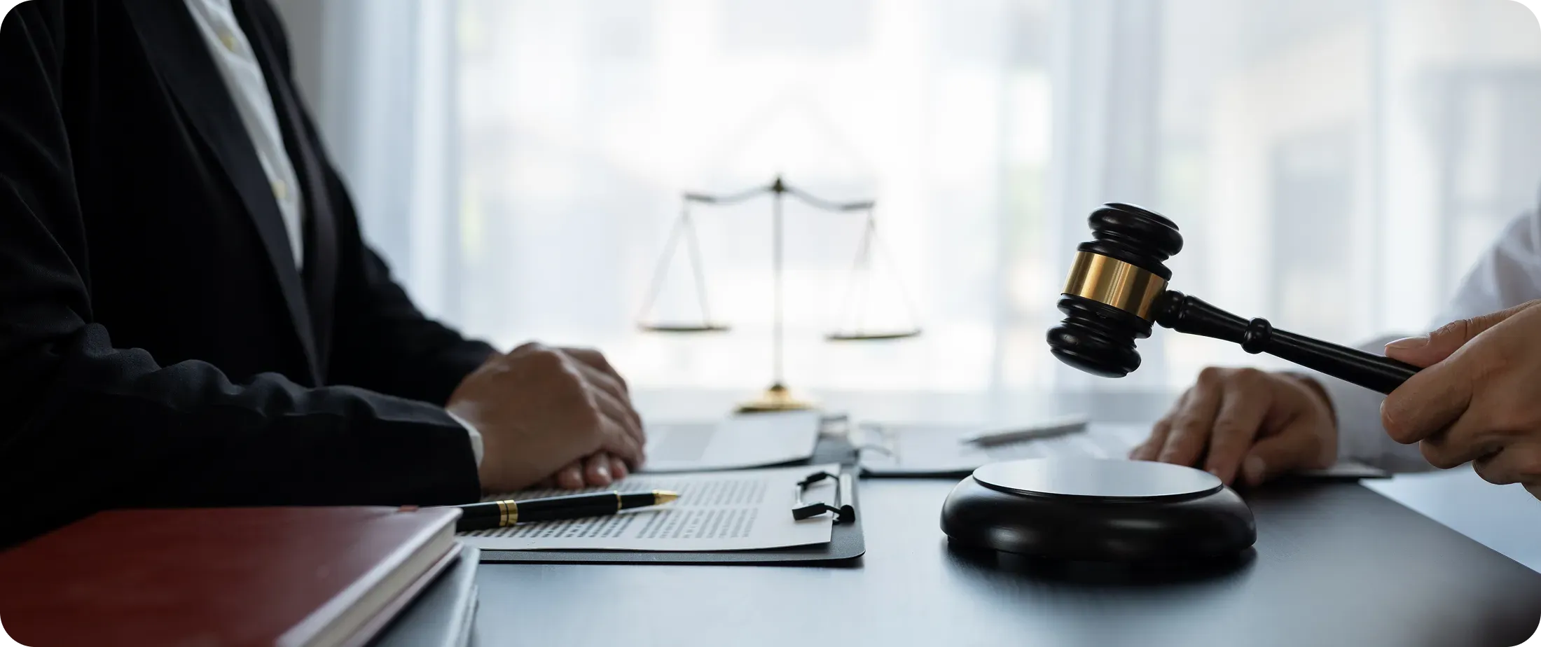 Judge’s gavel and legal documents on a desk, symbolizing decisions that require human judgment