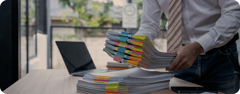 Man organizing colorful folders - data management and workflow setup