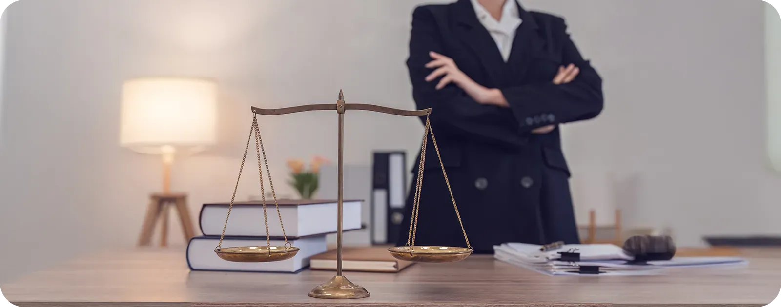 Scales of justice on a lawyer’s desk, symbolizing the balance between client confidentiality and professional judgment