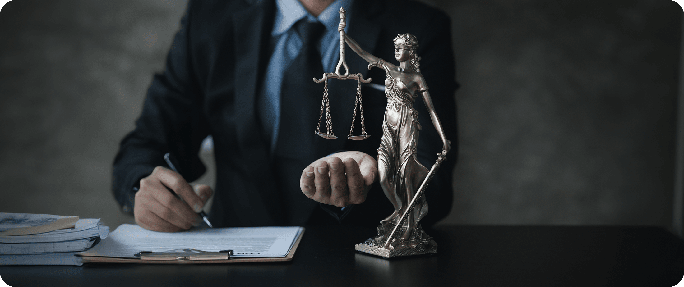 Statue of Lady Justice near a legal professional, symbolizing human judgment and responsibility in legal decision-making